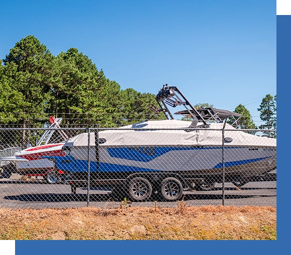 A boat is parked in the parking lot.